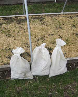 Row cover sandbags